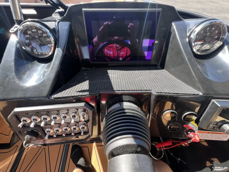 Slide: The Image of 2024 Heyday WT Surf boat dashboard with gauges, switches, and touchscreen display. - 5