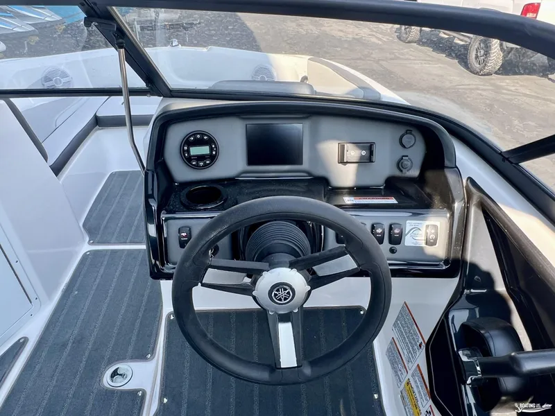 Slide: The Image of 2025 Yamaha AR190 boat dashboard with steering wheel and control panel. - 1