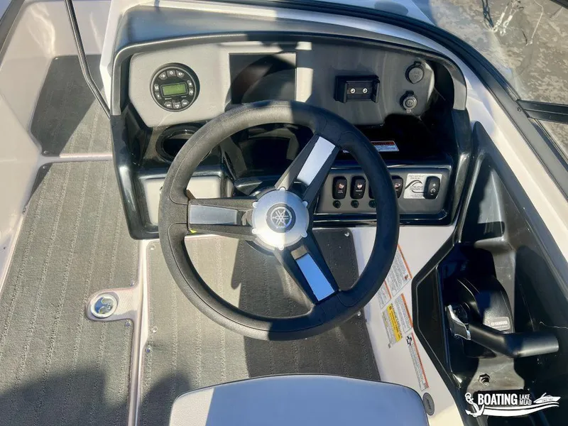 Slide: The Image of 2025 Yamaha AR190 boat dashboard with steering wheel and control panel. - 10