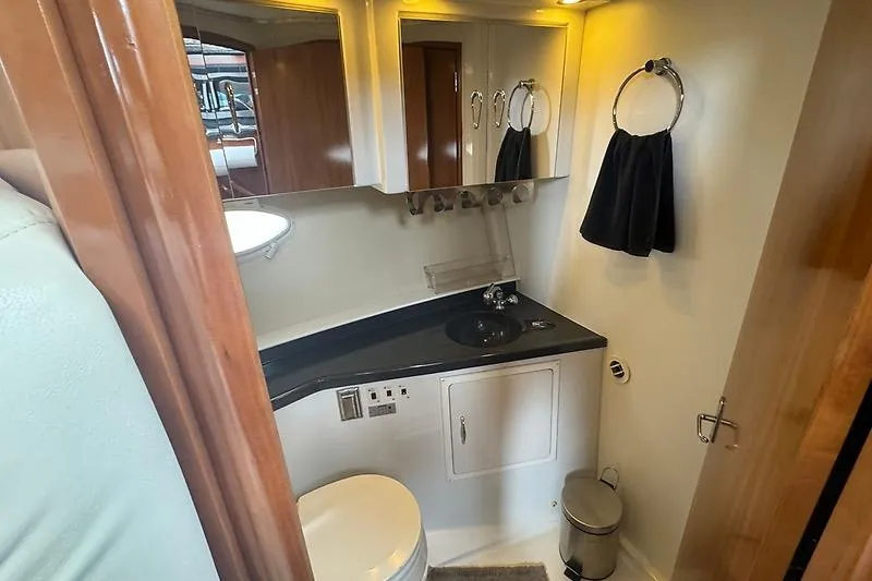 Slide: The Image of Bathroom interior of 2004 Carver 366 Motor Yacht with sink, mirror, and toilet. - 18