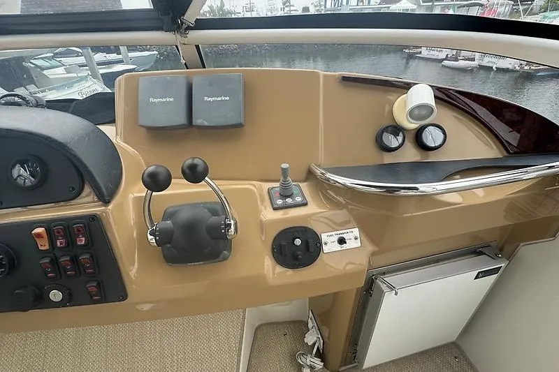 Slide: The Image of Helm of 2004 Carver 366 Motor Yacht with Raymarine electronics and dual throttle controls. - 20