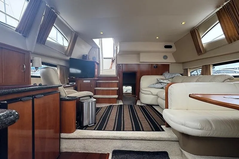 Slide: The Image of Luxurious interior of 2004 Carver 366 Motor Yacht with plush seating and modern amenities. - 23