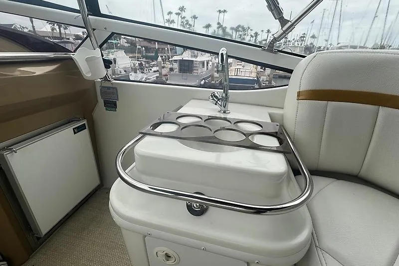Slide: The Image of 2004 Carver 366 Motor Yacht interior with sink and cup holder, marina view. - 25