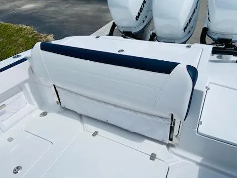 Slide: The Image of 2021 Nor-Tech 390 Center Console boat with white and blue seating. - 4