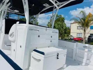 Slide: The Image of 2021 Nor-Tech 390 Center Console boat interior with seating and storage compartments. - 8