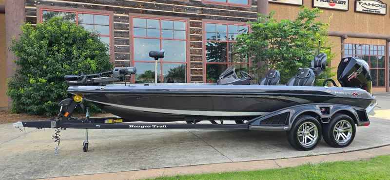 Slide: The Image of 2024 Ranger Z521R Ranger Cup Equipped boat on trailer, parked outdoors. - 0