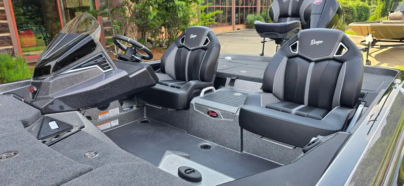 Slide: The Image of 2024 Ranger Z521R Ranger Cup Equipped boat interior with sleek black seating and modern dashboard. - 3