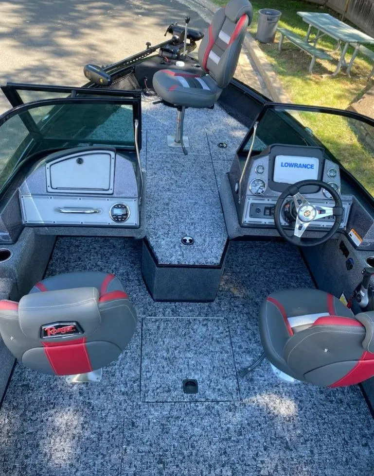 Slide: The Image of 2024 Ranger VS1782SC Reata boat interior with seating and control console. - 14