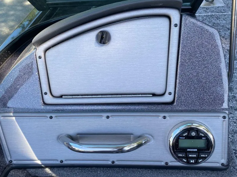 Slide: The Image of 2024 Ranger VS1782SC Reata boat dashboard with storage compartment and control panel. - 18