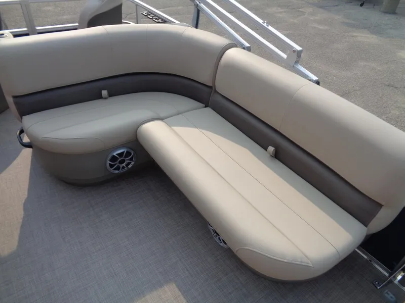 Slide: The Image of 2024 Sun Tracker Bass Buggy 18 DLX pontoon boat seating with beige upholstery. - 5