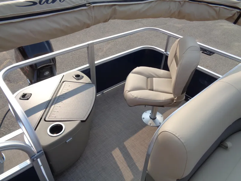 Slide: The Image of 2024 Sun Tracker Bass Buggy 18 DLX interior with seating and storage. - 7