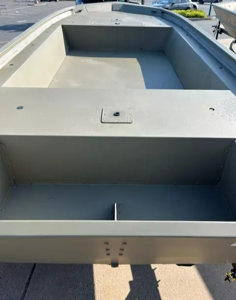 Slide: The Image of 2024 Tracker Grizzly 1754 Jon boat, spacious interior, durable design. - 4