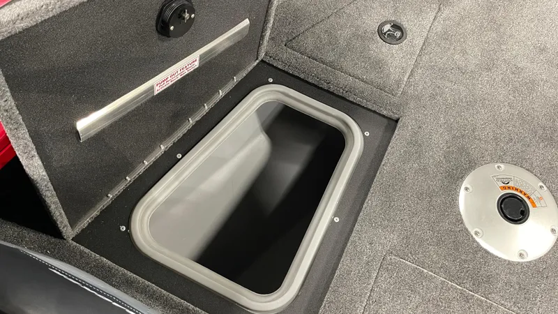 Slide: The Image of 2024 Tracker Targa V-19 WT boat storage compartment with open hatch. - 13