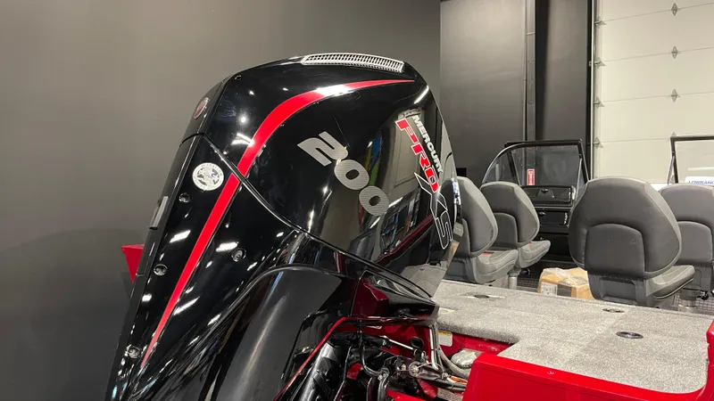 Slide: The Image of 2024 Tracker Targa V-19 WT boat with powerful 200 HP engine, sleek black and red design. - 4