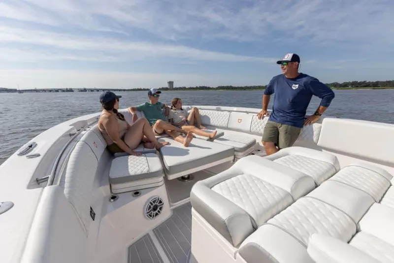 Slide: The Image of People relaxing on a 2025 Sea Fox 368 Commander Center Console boat. - 11