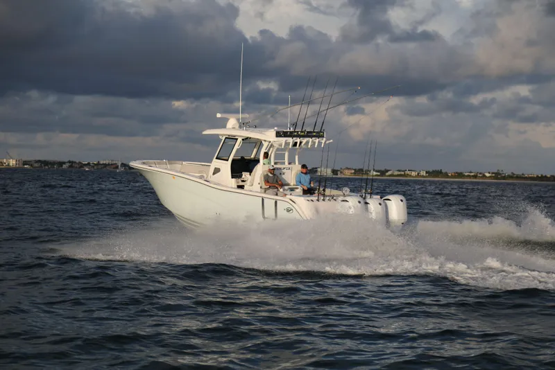 Slide: The Image of 2025 Sea Fox 368 Commander Center Console boat cruising on open water. - 15