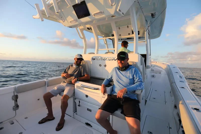 Slide: The Image of 2025 Sea Fox 368 Commander Center Console boat with passengers enjoying the ocean view. - 18