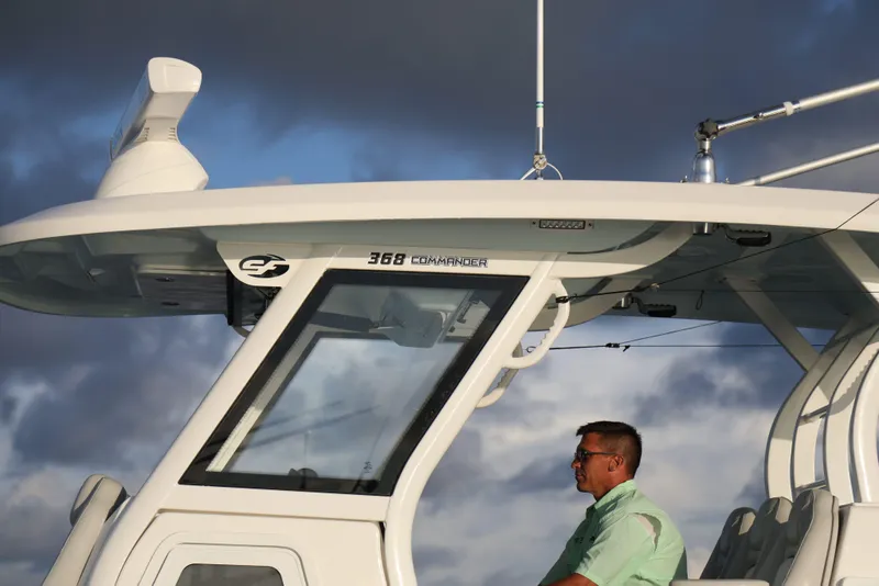 Slide: The Image of 2025 Sea Fox 368 Commander Center Console boat with a person at the helm. - 13