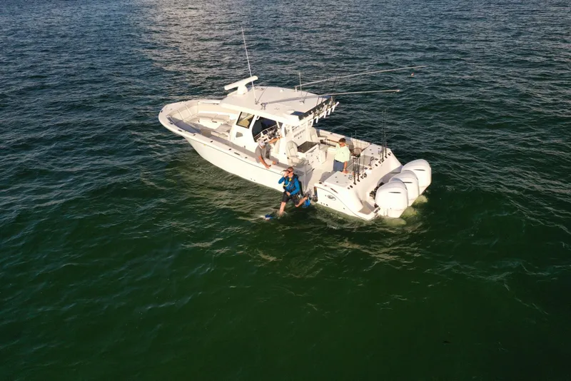 Slide: The Image of 2025 Sea Fox 368 Commander Center Console boat on open water. - 23