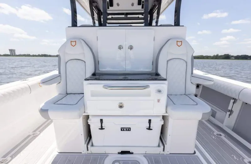 Slide: The Image of 2025 Sea Fox 368 Commander Center Console boat interior with seating and storage. - 4