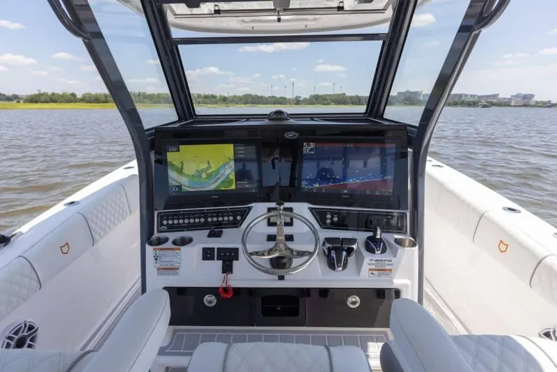 Slide: The Image of 2025 Sea Fox 368 Commander Center Console boat dashboard with advanced navigation systems. - 5