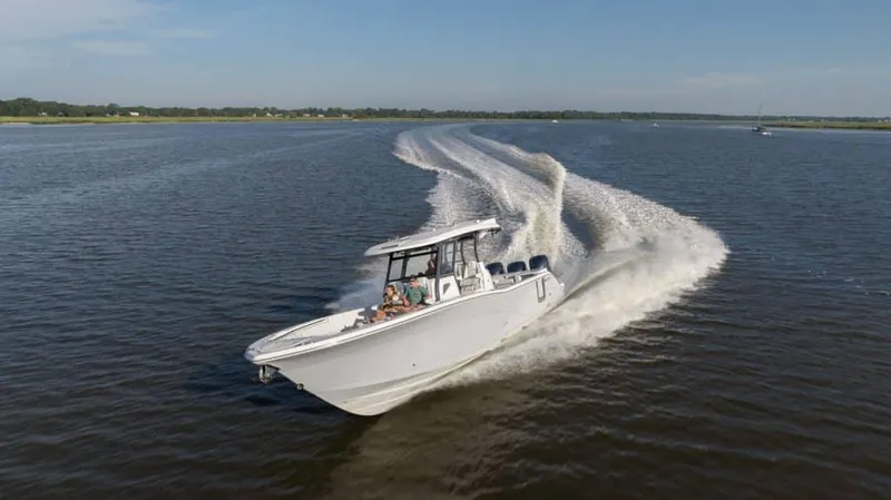 Slide: The Image of 2025 Sea Fox 368 Commander Center Console cruising on open water. - 16