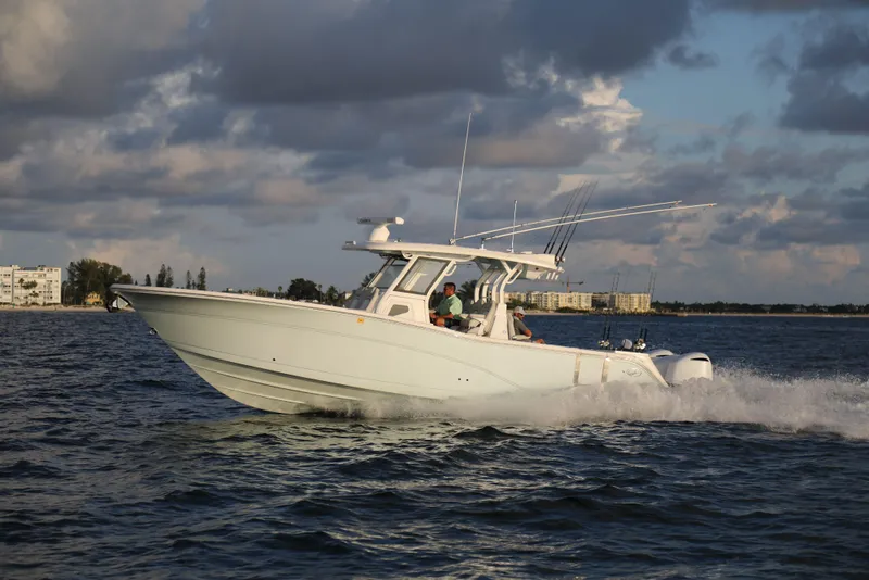 Slide: The Image of 2025 Sea Fox 368 Commander Center Console boat cruising on open water. - 5