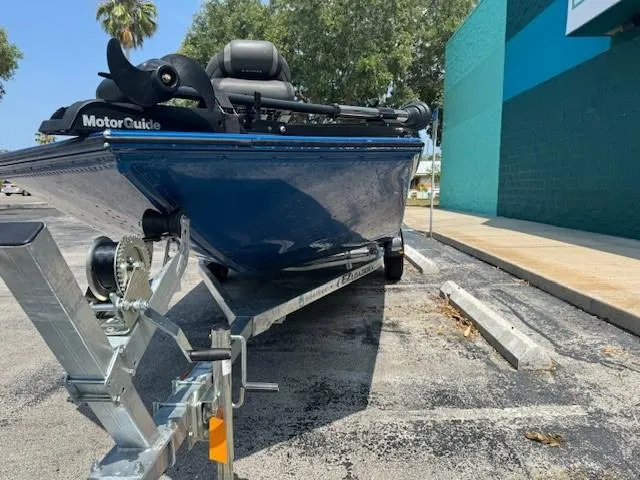 Slide: The Image of 2021 Lund 1875 Renegade boat on trailer, equipped with MotorGuide trolling motor. - 4