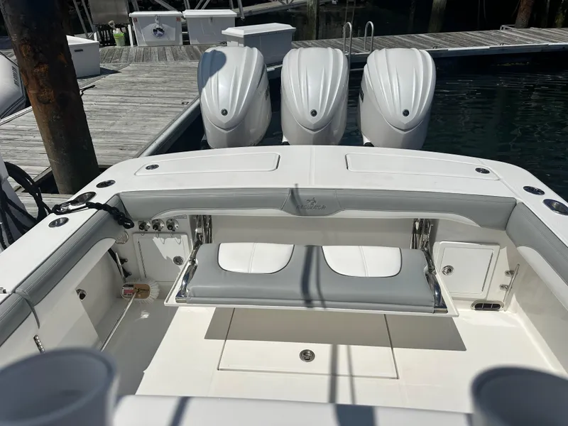 Slide: The Image of 2022 Regulator 34 boat with triple engines docked at marina. - 3