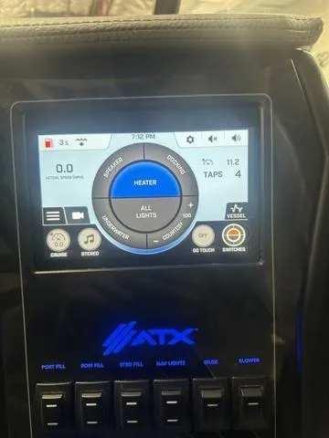 Slide: The Image of ATX Surf Boats 24 Type-S 2023 dashboard with touchscreen controls and illuminated buttons. - 10
