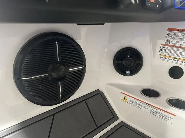 Slide: The Image of 2023 ATX Surf Boats 24 Type-S interior speakers and cup holders. - 17