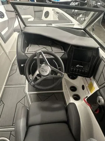 Slide: The Image of 2023 ATX Surf Boats 24 Type-S cockpit with steering wheel and dashboard. - 5