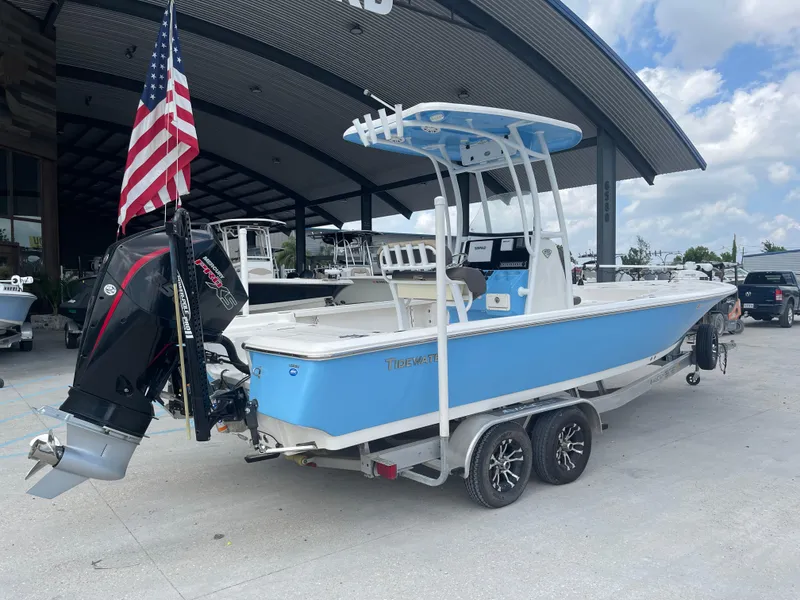 Slide: The Image of 2019 Tidewater 2410 Bay Max boat on a trailer with an American flag. - 1