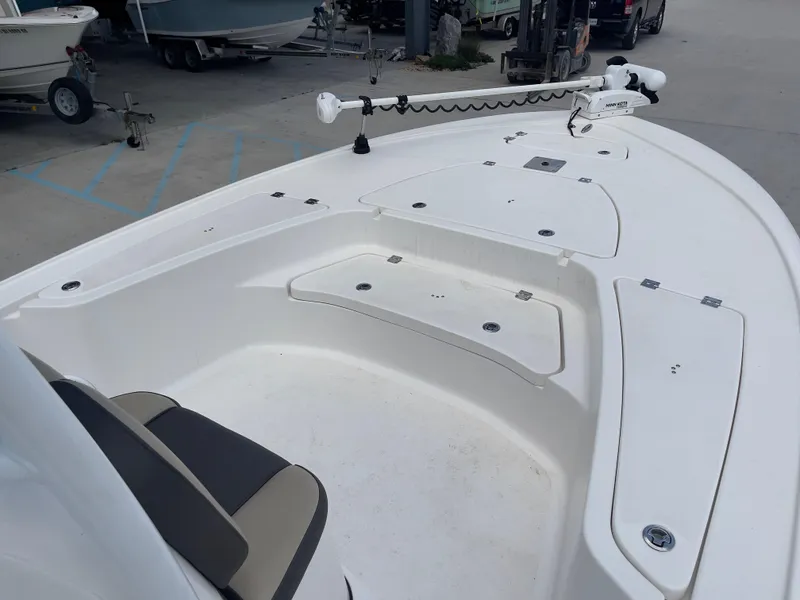 Slide: The Image of 2019 Tidewater 2410 Bay Max boat with spacious deck and storage compartments. - 10
