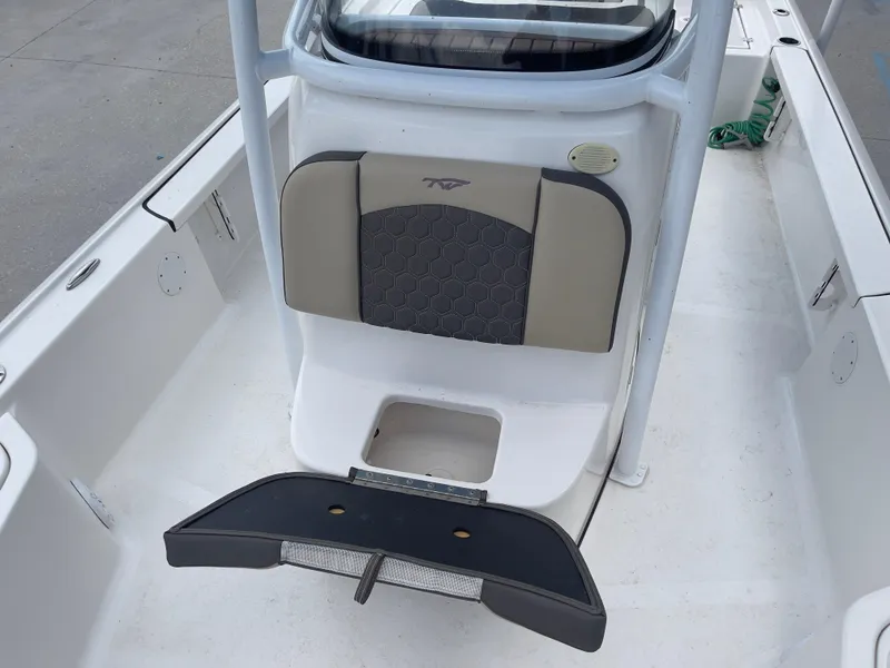 Slide: The Image of 2019 Tidewater 2410 Bay Max boat interior with seating and storage. - 14