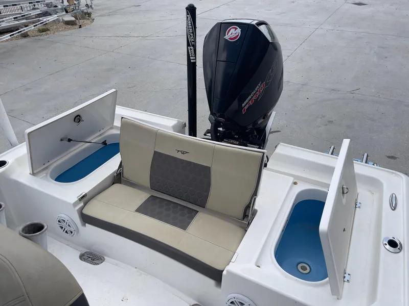Slide: The Image of 2019 Tidewater 2410 Bay Max boat with seating and storage compartments. - 16