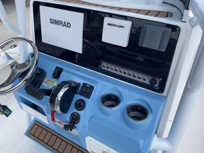 Slide: The Image of 2019 Tidewater 2410 Bay Max boat console with Simrad and Mercury electronics. - 20