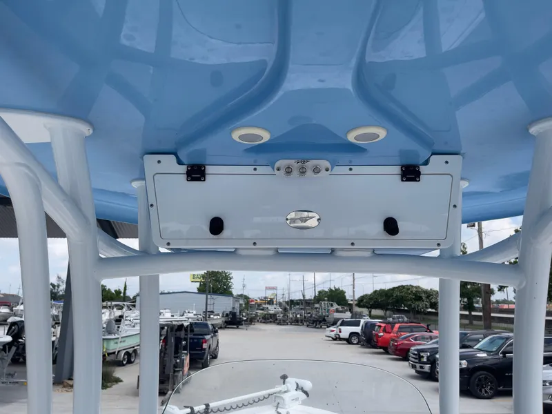Slide: The Image of 2019 Tidewater 2410 Bay Max boat console and T-top view. - 21