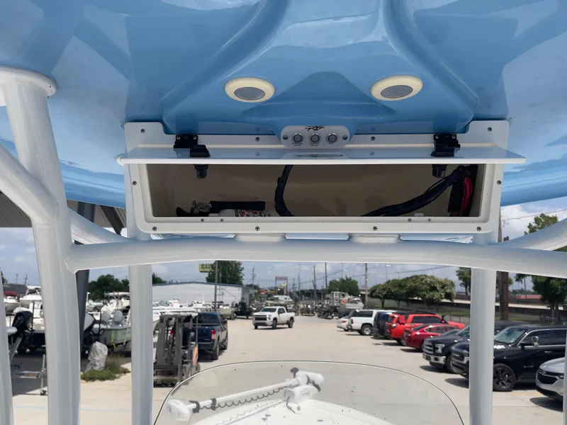 Slide: The Image of 2019 Tidewater 2410 Bay Max boat console with electronics and storage. - 22