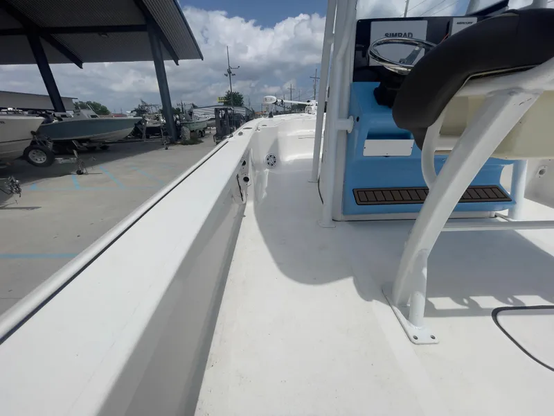 Slide: The Image of 2019 Tidewater 2410 Bay Max boat deck at a marina. - 26