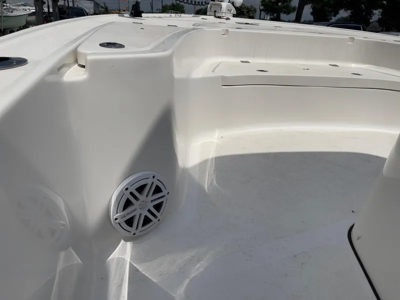 Slide: The Image of 2019 Tidewater 2410 Bay Max boat interior with speaker and seating area. - 27