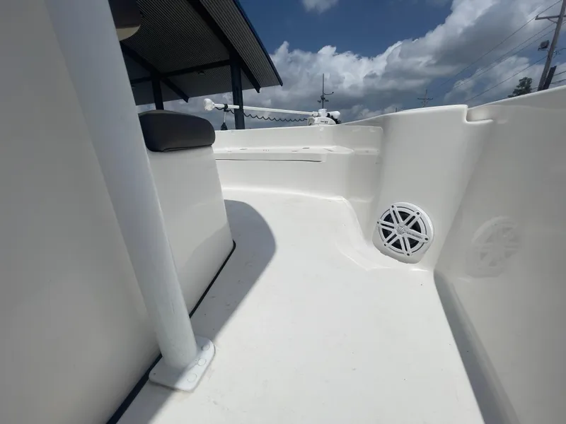 Slide: The Image of 2019 Tidewater 2410 Bay Max boat interior with seating and speaker. - 28