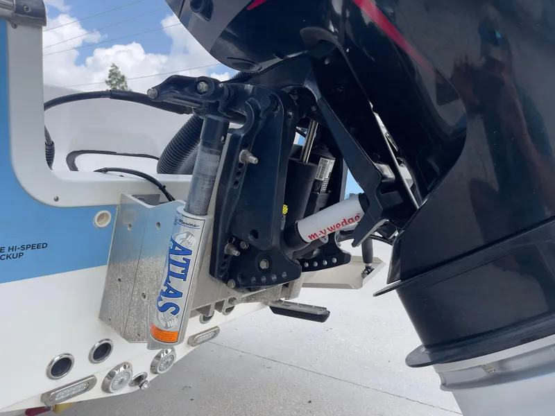 Slide: The Image of Close-up of 2019 Tidewater 2410 Bay Max boat motor and Atlas hydraulic jack plate. - 37