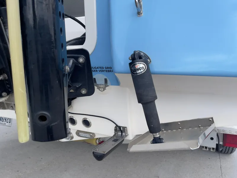 Slide: The Image of Close-up of the 2019 Tidewater 2410 Bay Max boat's transom and trim tab. - 38