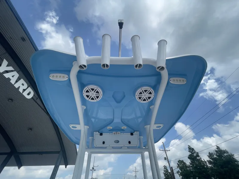 Slide: The Image of 2019 Tidewater 2410 Bay Max boat with blue T-top and rod holders. - 39