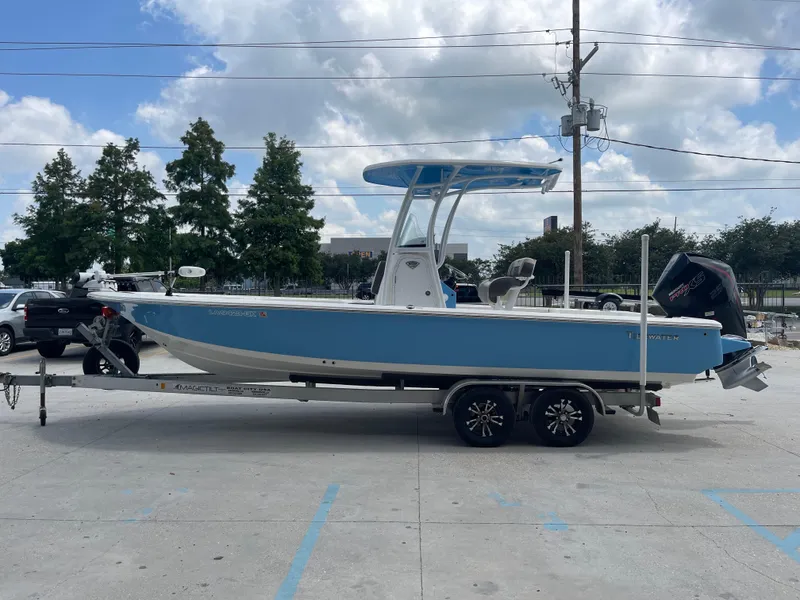 Slide: The Image of 2019 Tidewater 2410 Bay Max boat on a trailer in a parking lot. - 5