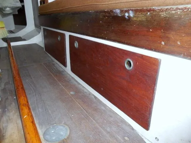 Slide: The Image of Interior of 1961 Rhodes Swiftsure boat with wooden storage compartments. - 27