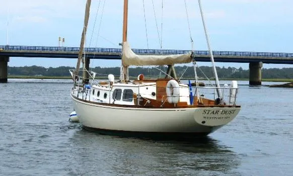 Slide: The Image of 1961 Rhodes Swiftsure sailboat "Star Dust" on water near a bridge. - 3