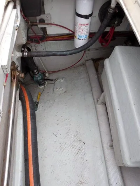 Slide: The Image of Interior view of a 1961 Rhodes Swiftsure boat, showing wiring and components. - 34