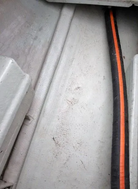 Slide: The Image of Close-up of 1961 Rhodes Swiftsure boat interior with visible cable. - 36